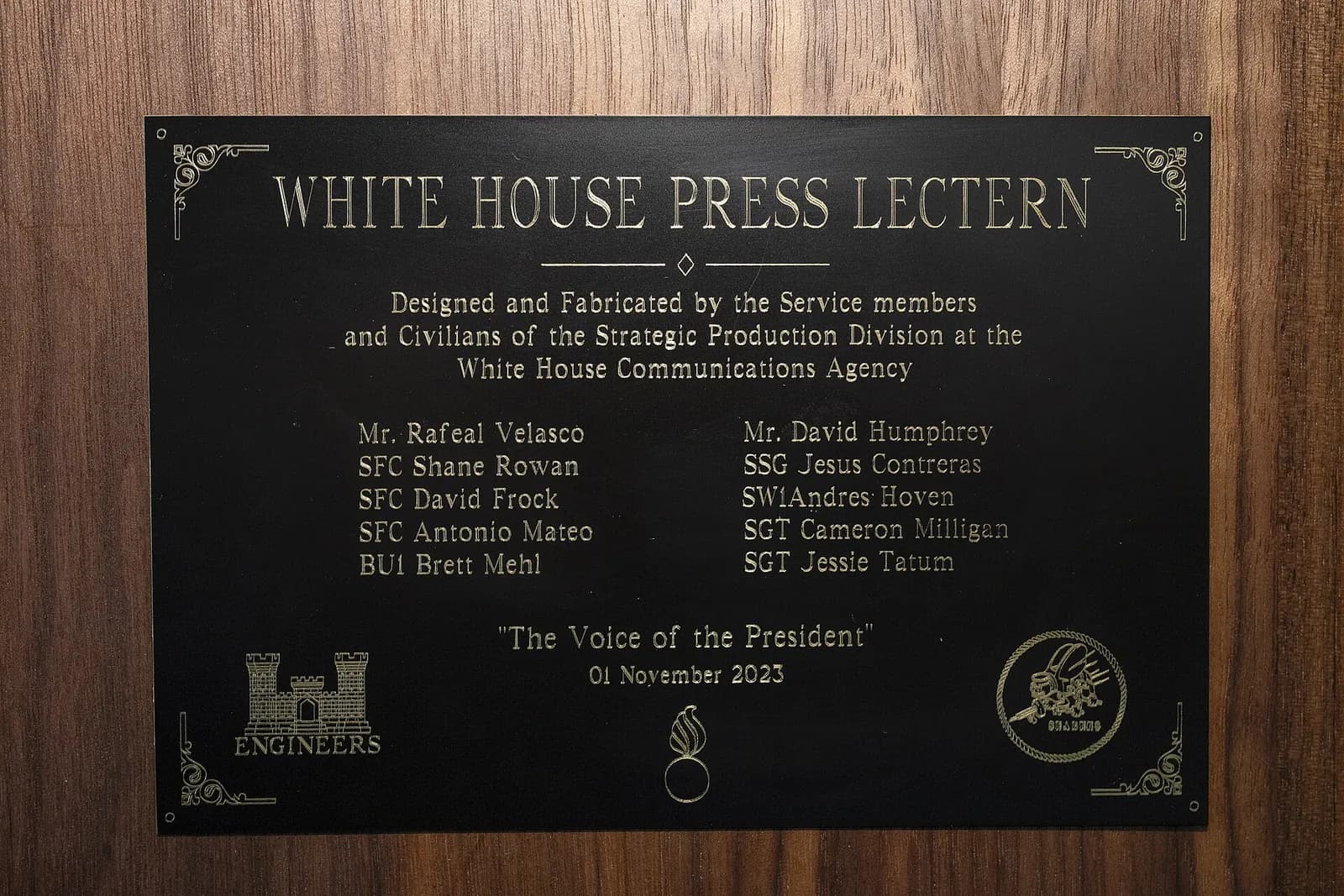 The engraved plaque on the White House press lectern used in the James S. Brady Press Briefing Room