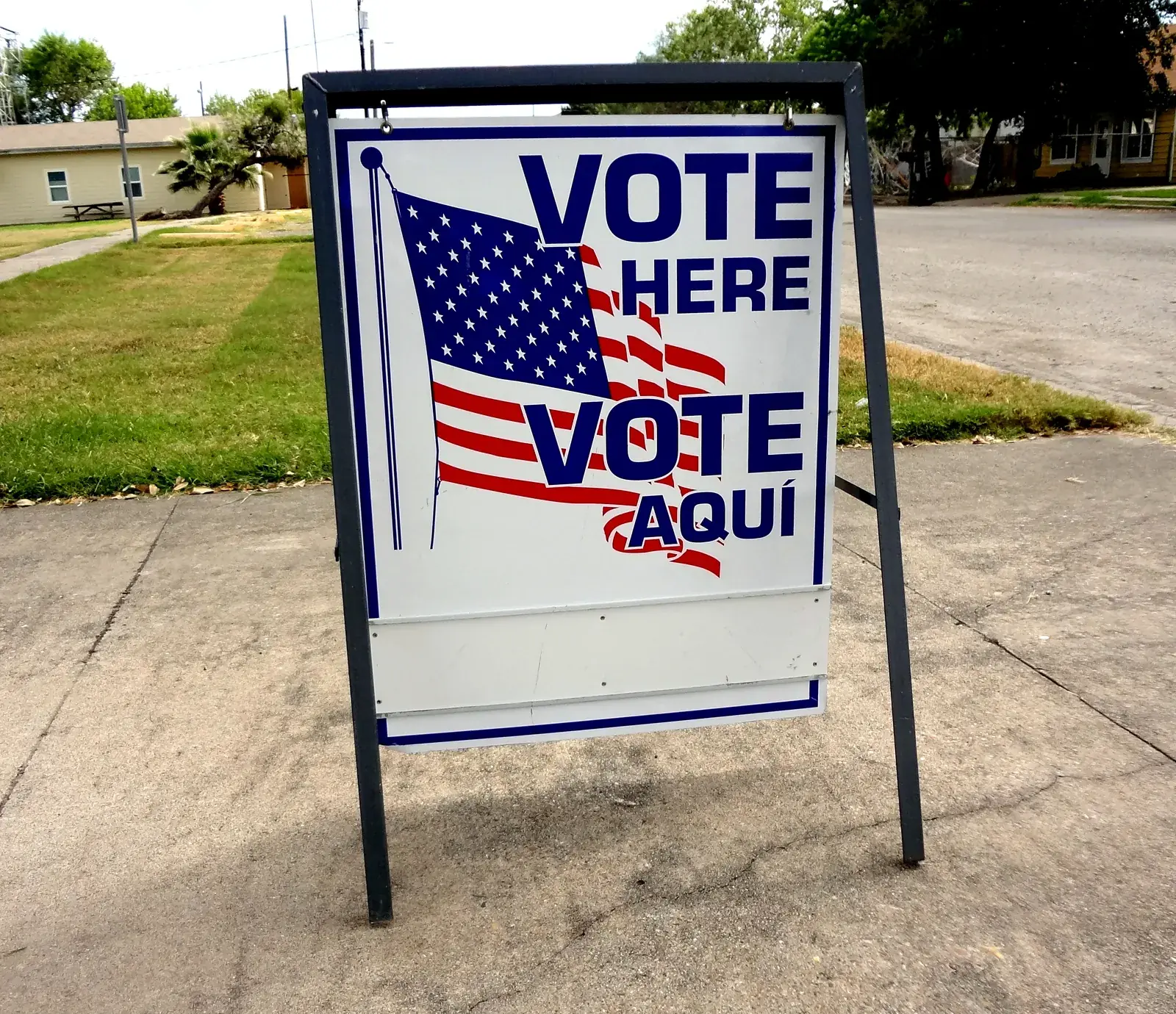 A bilingual 'Vote Here / Vote Aquí' sign outside a polling place in Taft, Texas (file photo, 2016)