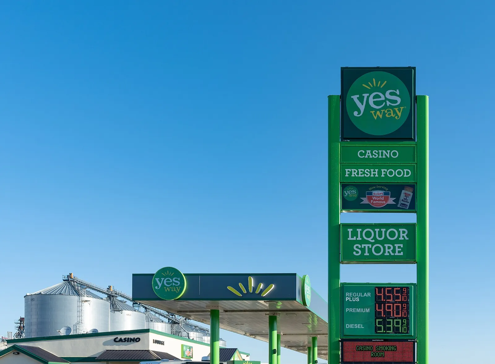 A roadside gas station sign listing fuel prices in Fort Pierre, South Dakota