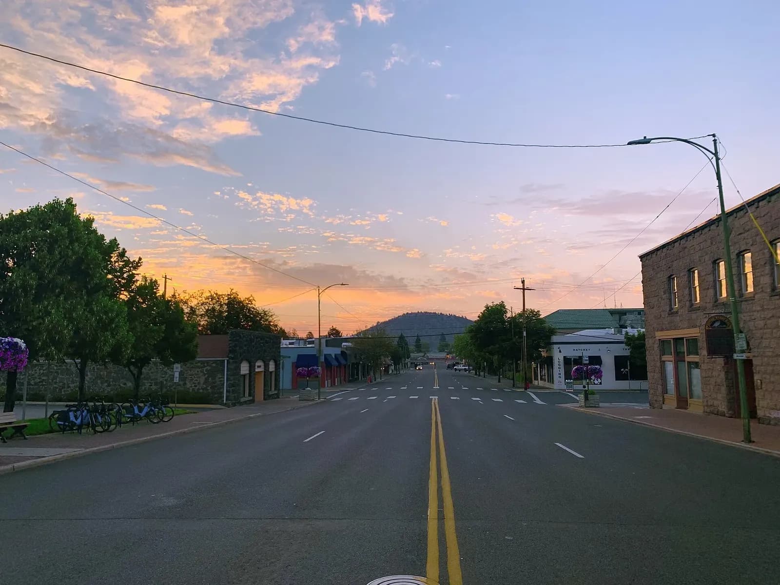 Downtown Bend, Oregon, with the volcanic cinder cone of Pilot Butte rising behind the city